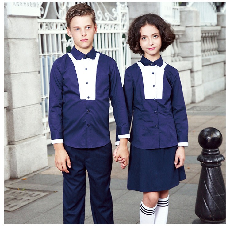 El OEM diseña la nueva camisa del uniforme escolar del azul marino del algodón del Style100% para la muchacha y el muchacho